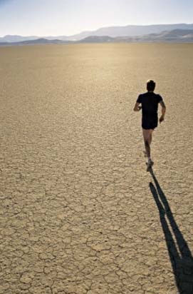 man running through the desert